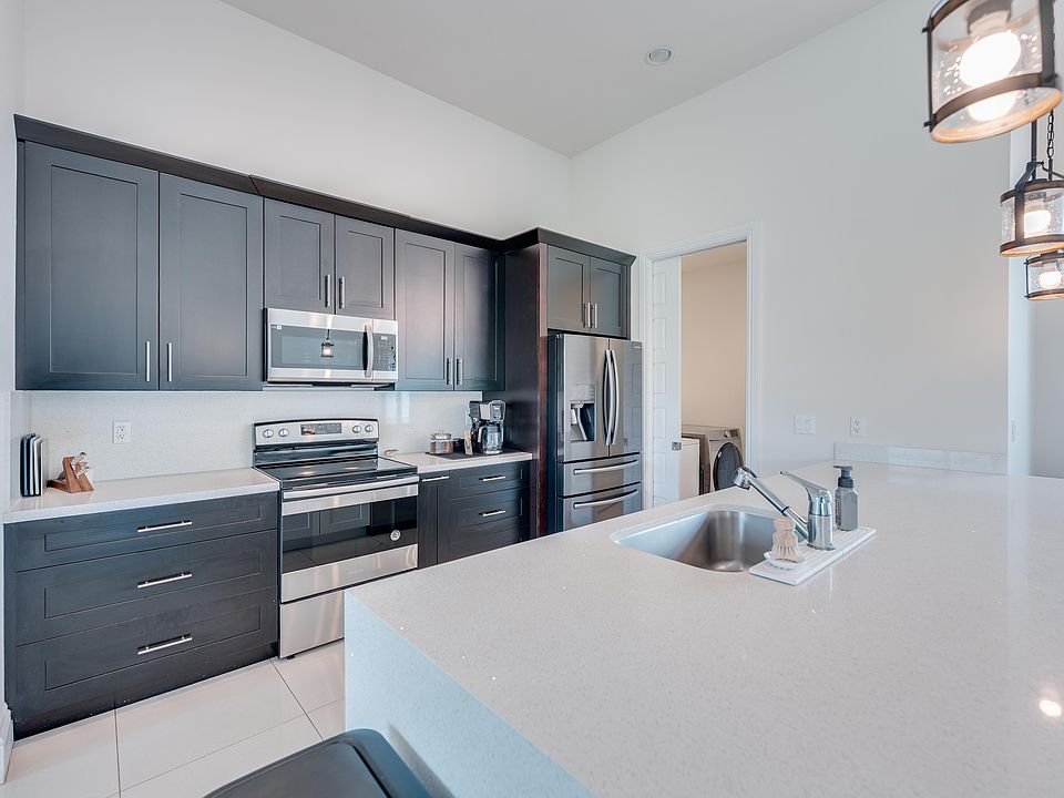 Kitchen with large waterfall island