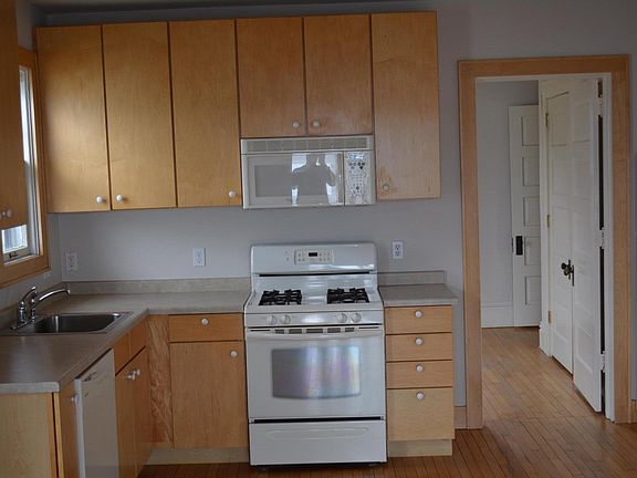 Kitchen w/ maple cabinets and modern appliances