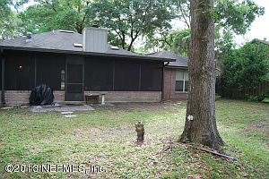 shady fenced back yard