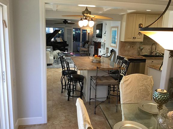 PORTIONS OF LIVING RM, BREAKFAST BAR(ISLAND), DINING RM AND KITCHEN