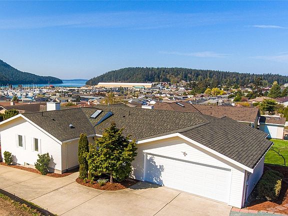 Side view of home showing garage and courtyard entry access