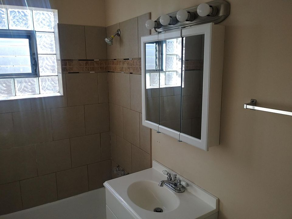 Bathroom: New sink, vanity and medicine cabinet. Tub has been sprayed.