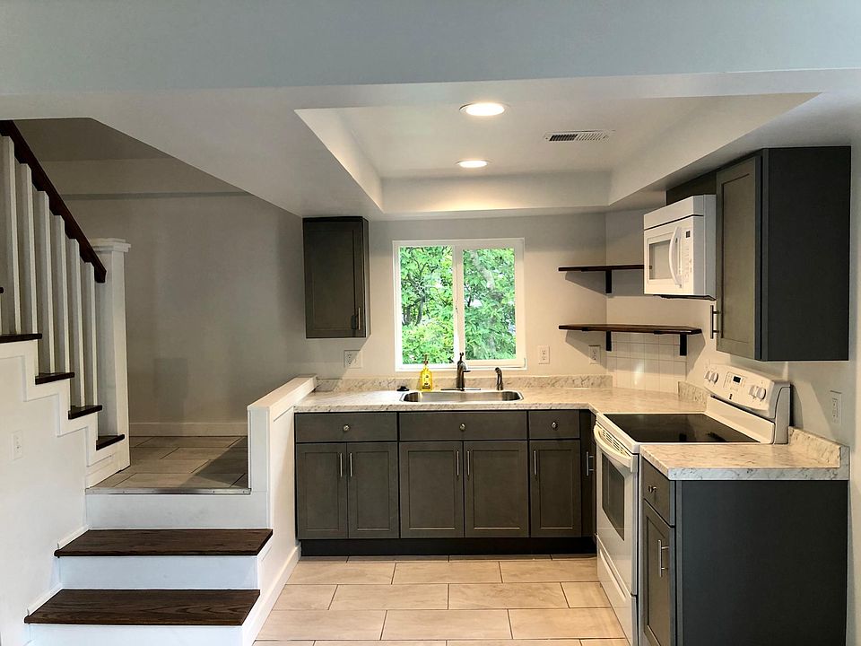 Kitchen and stairs leading to third story.