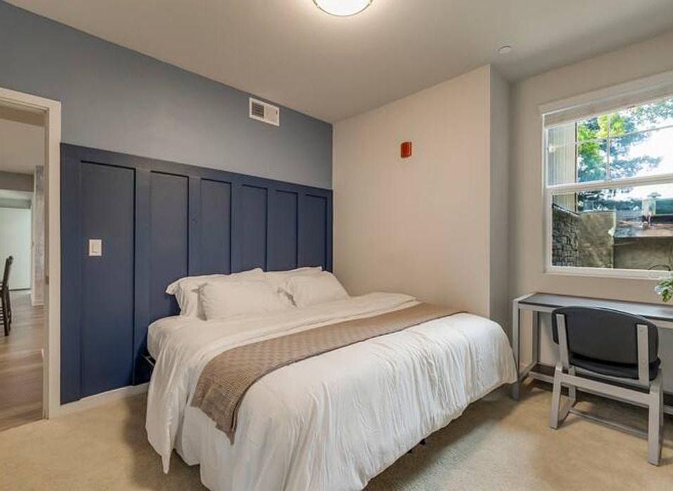 Cozy up! This room has a king size bed with a desk and chair.