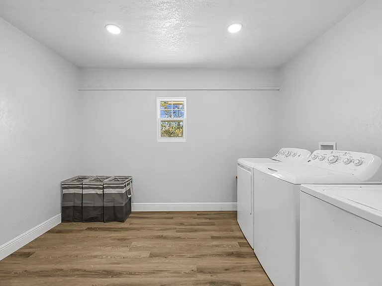 Two sets of washers and dryers.