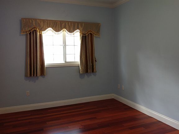 Clean bedrooms with nice drapes and large closets.