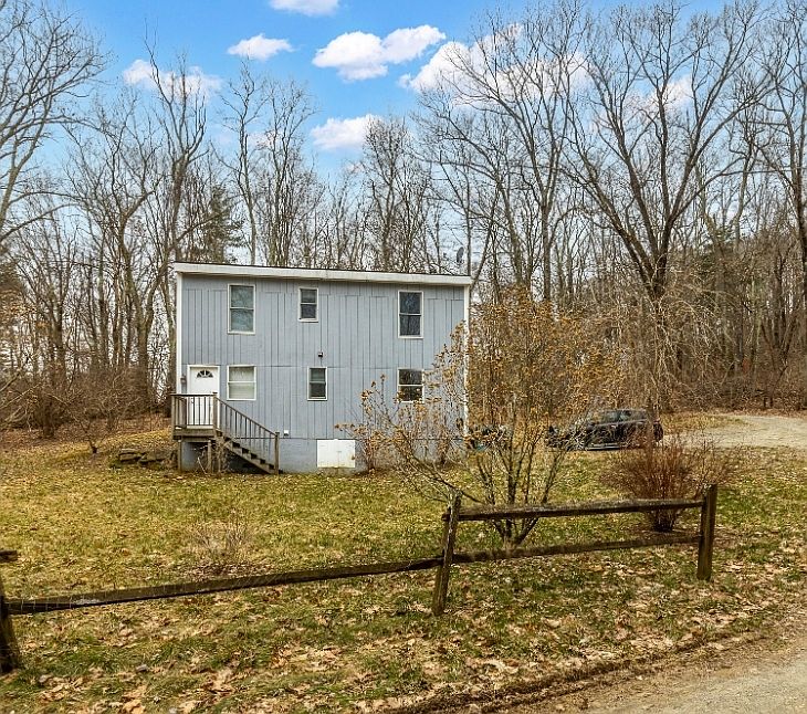 View of yard featuring second entrance to house