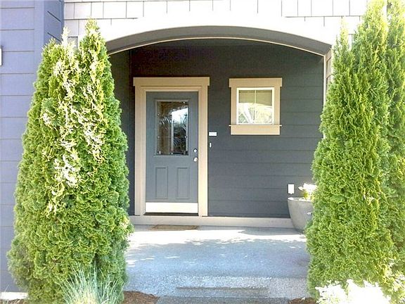This extra large covered front porch welcomes friends and family