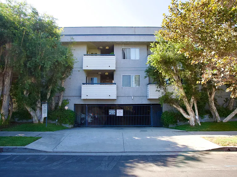 Street View of Building and subterranean parking garage. This unit has a tandem space for two cars.