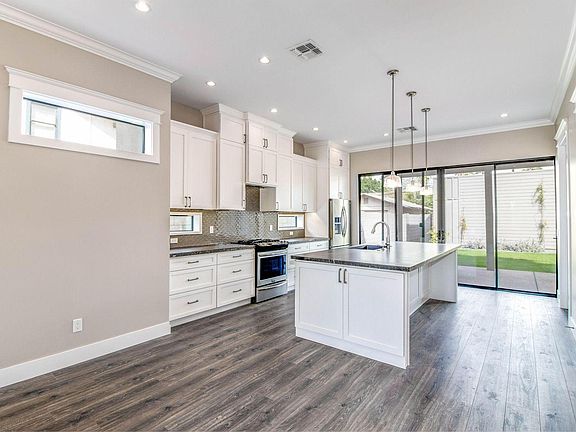 Oversized glass sliders to outdoor patio