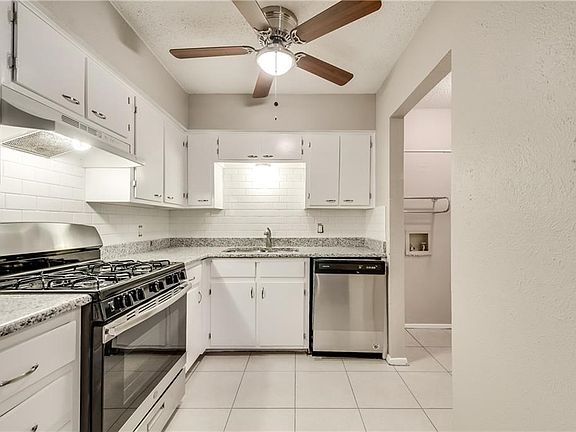 Updated kitchen and photo shows the laundry room on the right