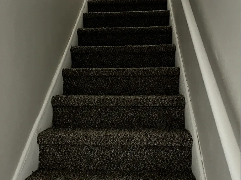 stairs lead to bedroom and bathroom upstairs