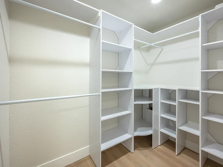 Primary Walk in Closet w/ adjustable shelving