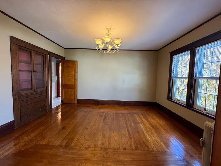This lovely roomy dining room a gorgeous built in hutch to store your finer entertainment pieces to be on display. Below the two hutch glass doors is a bank of built in draws.
