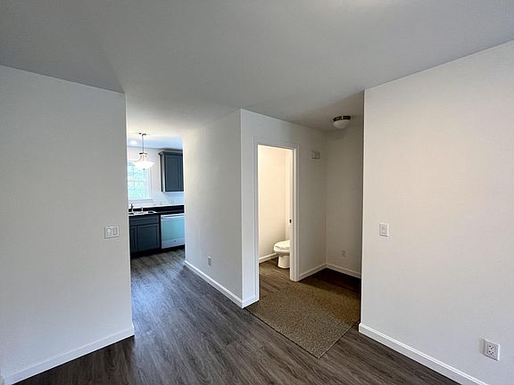 Living room into powder room & Kitchen