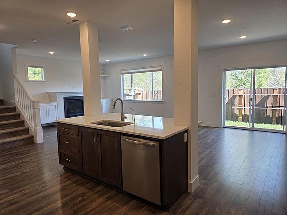 Open concept kitchen and living room, with views outside!