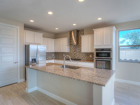 Fully stocked kitchen with stainless steel appliances