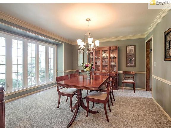Dining Room with new carpet and light fixture.