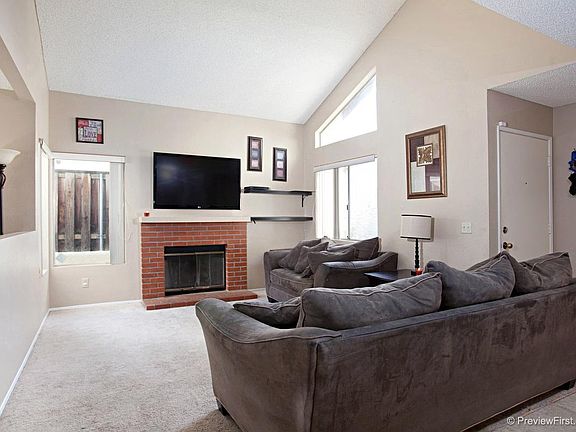 Gas fireplace in living room, the carpets have been replaced with tile all downstairs