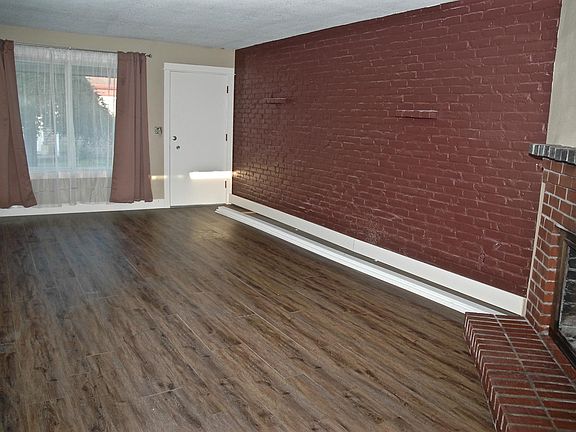 Spacious living area with luxury flooring. 