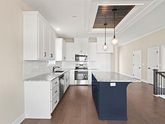 Large open kitchen with eating area at the island.