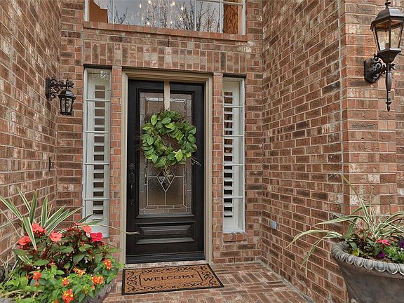 The front walkway is brick-lined and landscaped. As you approach the home you are greeted by the stained hardwood front door with sparkling leaded glass. Already you can tell - this is going to be a home of extraordinary quality.