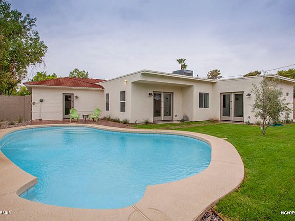 Pool and grassy backyard