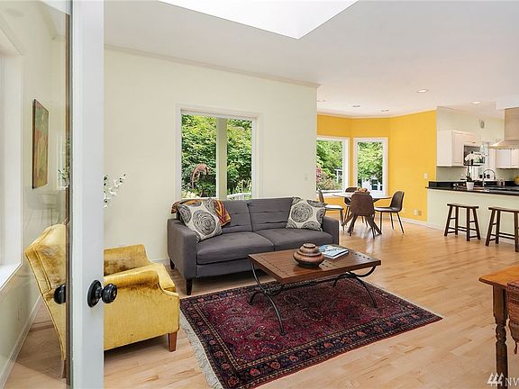 Open space provides much flexibility with room for dining, living, lounging. Hardwood Maple floors; skylights can be opened and close automatically in the rain!