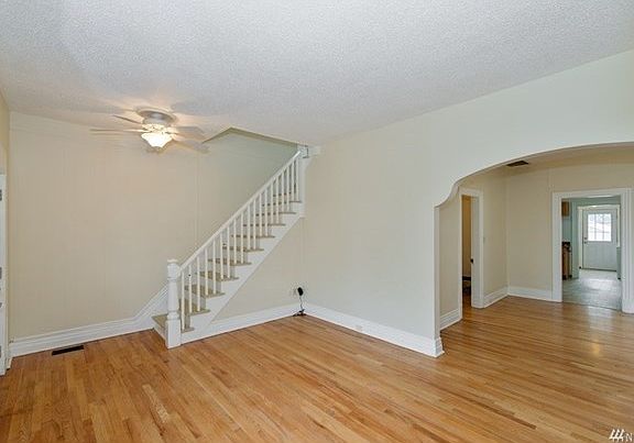 Beautiful arched entries, gleaming hardwoods and banister gives this home a lot of charm.