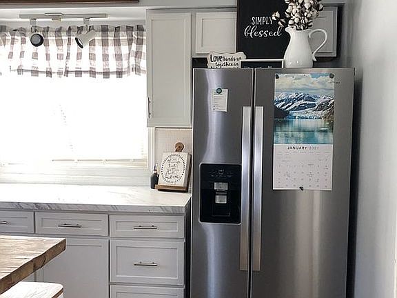 Kitchen w/ brand new fridge