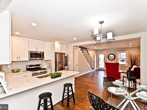 Open living, dining and kitchen on first floor
