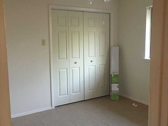 Bedroom 2 has bifold door for closet.