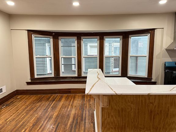 Large eat in bar overlooking bay window with brand new high efficiency windows.
