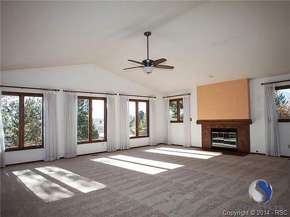 Living room with gas fireplace and 5 large windows to let light