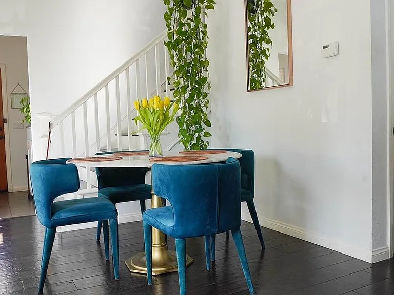 dining room, view to front door and staircase to 2nd floor