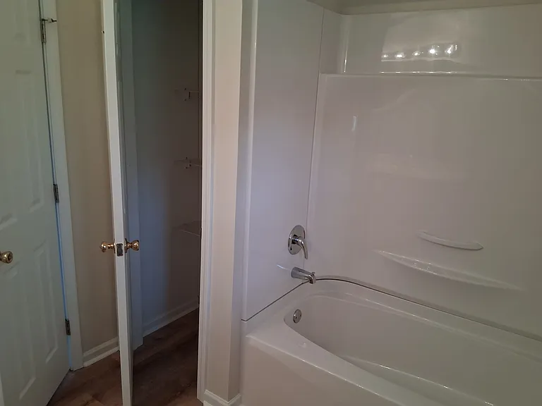 Hall bathroom and door to linen closet
