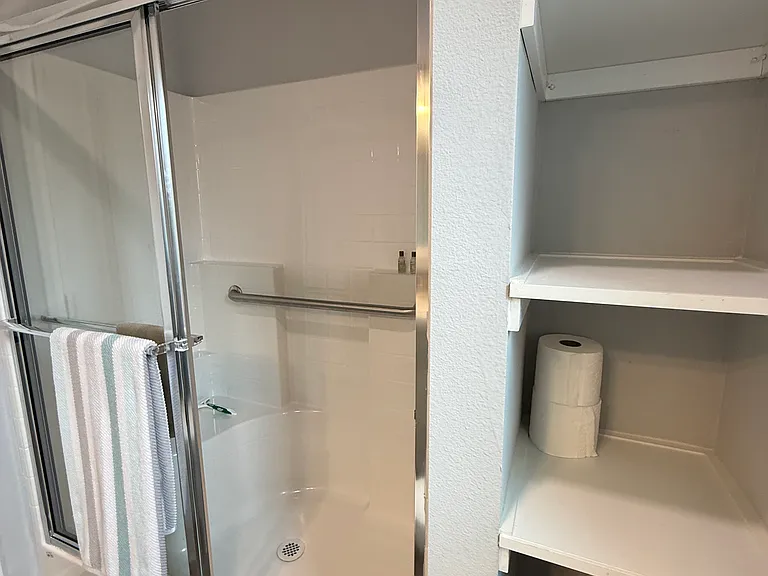 shower and linen storage