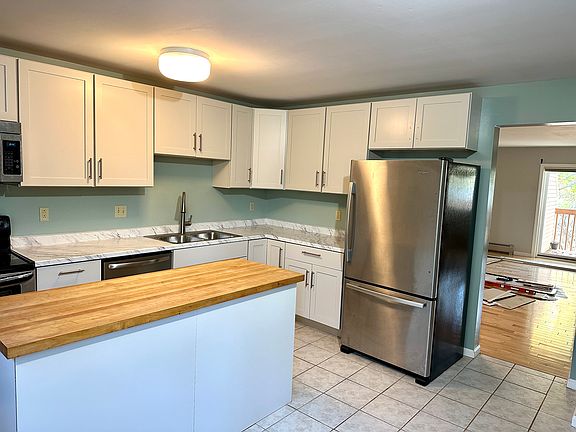 Kitchen looking into living room