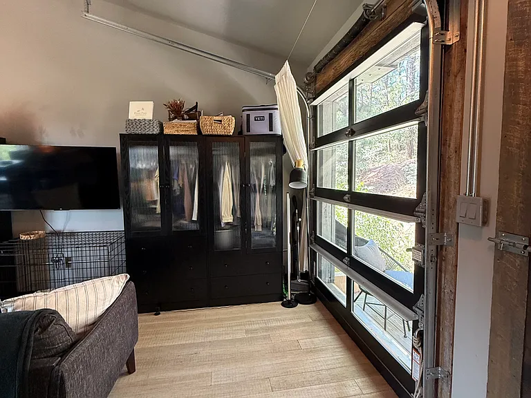 View from washer/dryer unit. Studio set up with living area near entrance