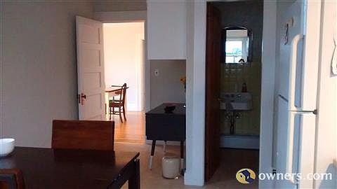 kitchen looking into 1/2 bath & dining room