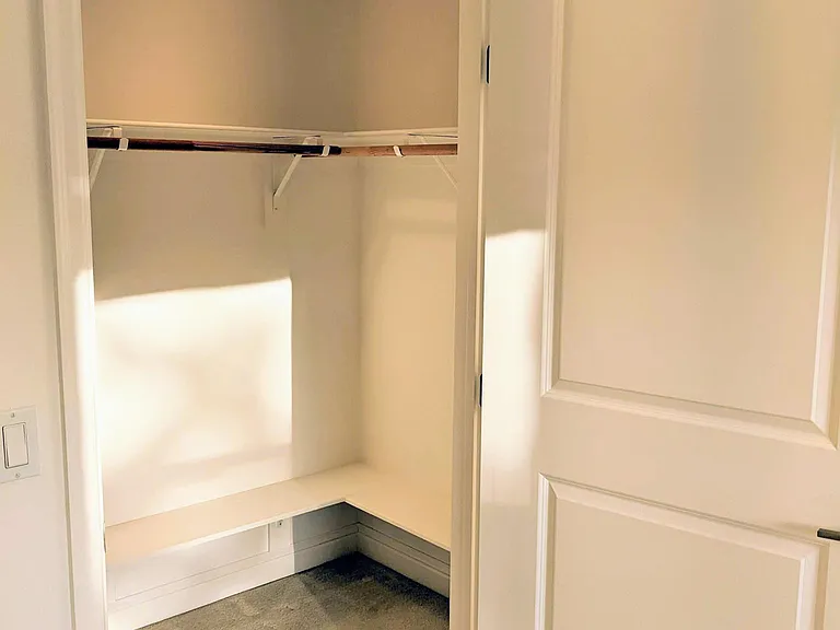 Bedroom 2 Walk-in Closet with storage shelves.