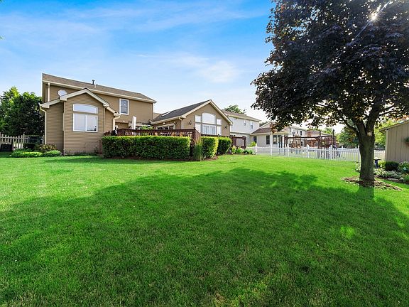 Expansive fenced backyard adjacent to large park