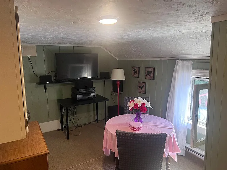 2nd floor dining area. Large screen tv and storage dressers