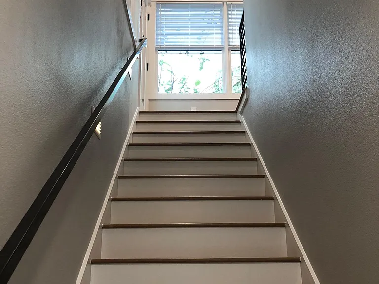 enclosed stairwell leading to the upstairs apartment