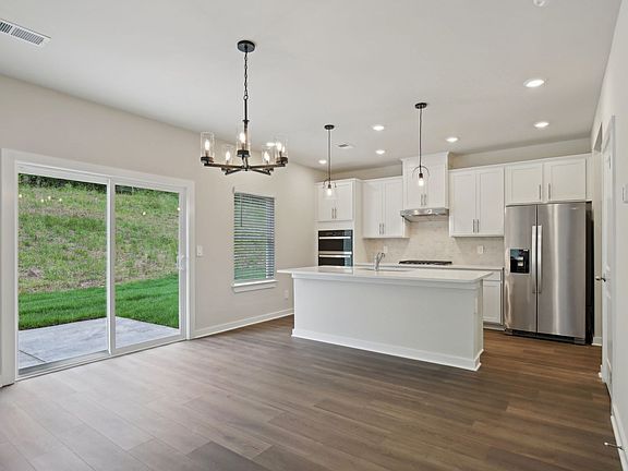 The open-concept floorplan allows for an easy flow between the kitchen and dining areas.