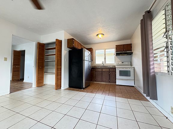 Open kitchen, viewing from the living room. Bedroom is on the left.