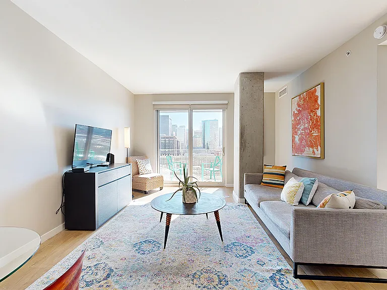 Apartment living room with wood-style flooring.