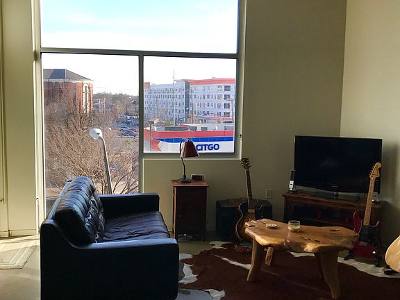 Spacious living area w/ huge floor to ceiling windows
