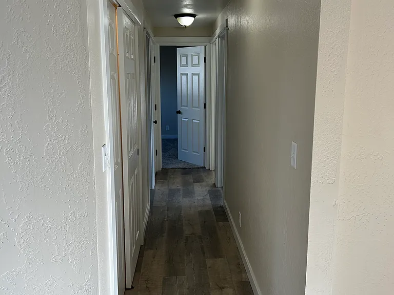 Hallway to bathroom and bedrooms
