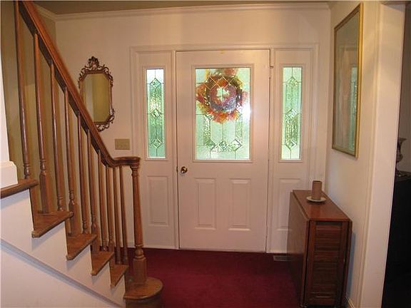 Leaded glass door with sidelights & oak staircase